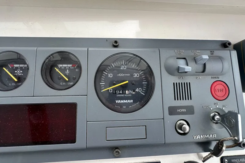 Slide: The Image of Control panel of a 2001 Northern Bay 36 boat with Yanmar engine gauges. - 32