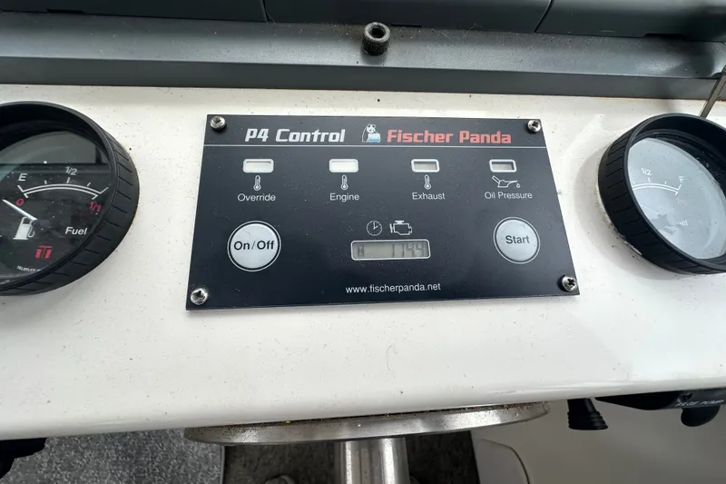 Slide: The Image of Control panel of a 2001 Northern Bay 36 boat with gauges and switches. - 16