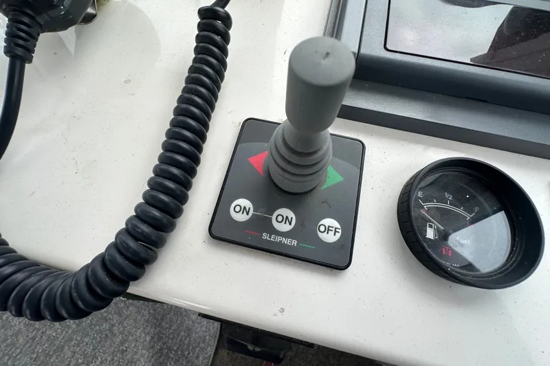 Slide: The Image of Control panel of a 2001 Northern Bay 36 boat with fuel gauge and lever. - 15