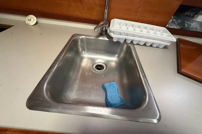 Slide: The Image of Stainless steel sink with sponge and ice tray in 2001 Northern Bay 36 boat. - 25