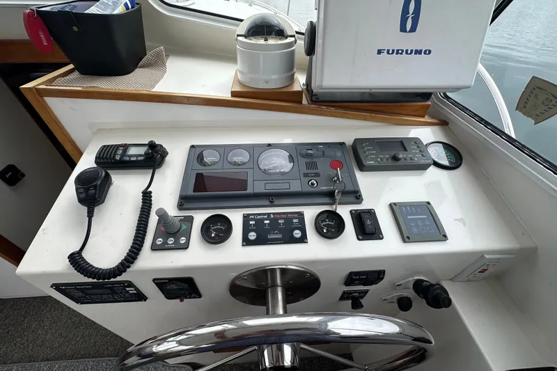 Slide: The Image of Helm of 2001 Northern Bay 36 boat with navigation and communication equipment. - 14