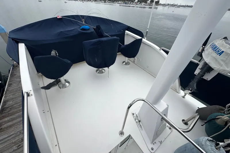 Slide: The Image of Northern Bay 36 boat deck, 2001 model, with covered seating and Yamaha motor. - 28