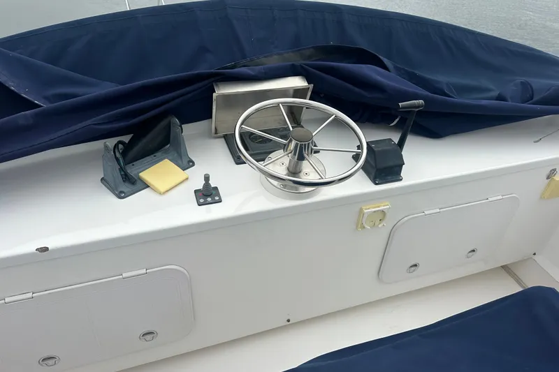 Slide: The Image of Helm of 2001 Northern Bay 36 boat with steering wheel and controls. - 30