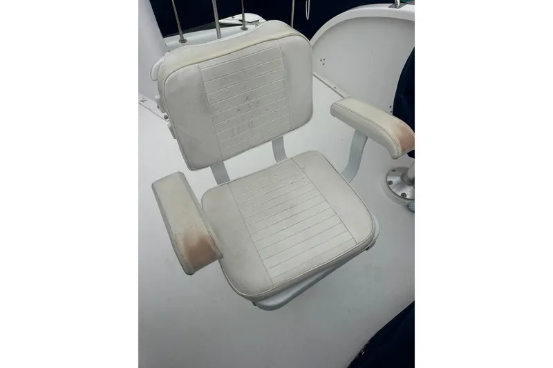 Slide: The Image of White captain's chair on a 2001 Northern Bay 36 boat deck. - 31