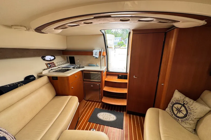 Slide: The Image of Interior of 2008 Tiara 3000 Open yacht with cozy seating and compact kitchen area. - 22