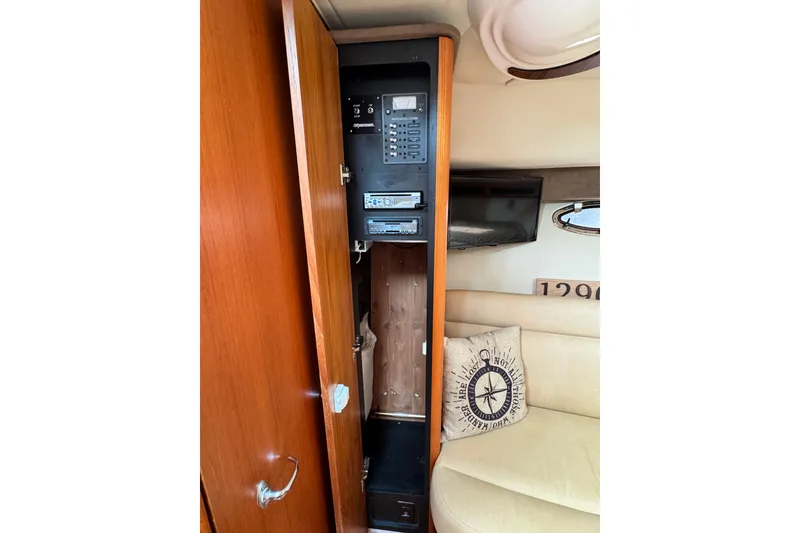 Slide: The Image of 2008 Tiara 3000 Open yacht interior with control panel and cozy seating area. - 20