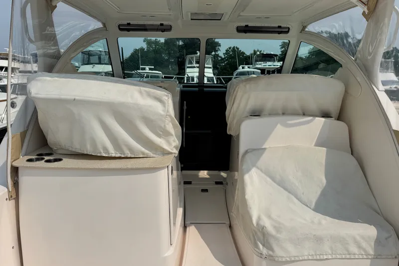 Slide: The Image of Interior view of a 2008 Tiara 3000 Open boat with covered seating and cup holders. - 2