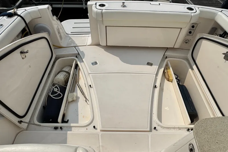 Slide: The Image of 2008 Tiara 3000 Open boat deck with open storage compartments. - 14