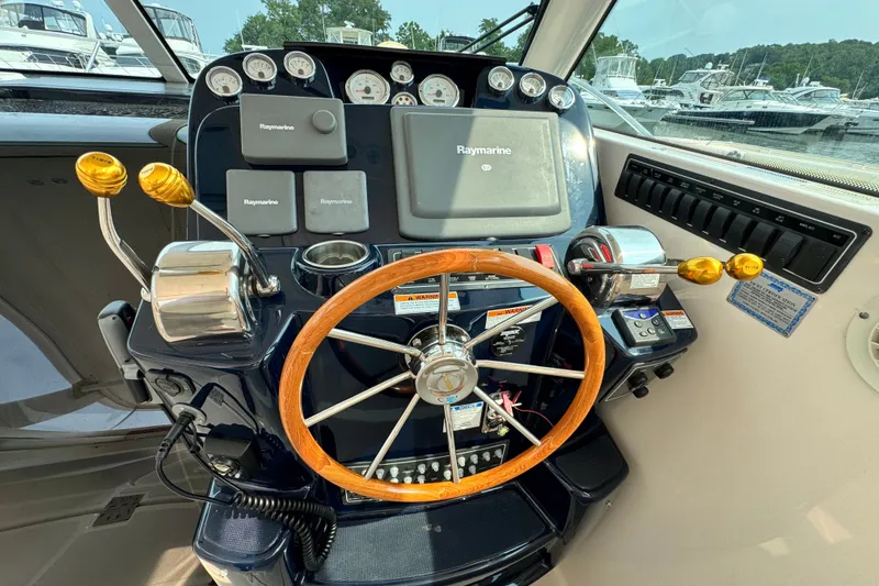 Slide: The Image of Helm of 2008 Tiara 3000 Open boat with Raymarine navigation system and wooden steering wheel. - 8