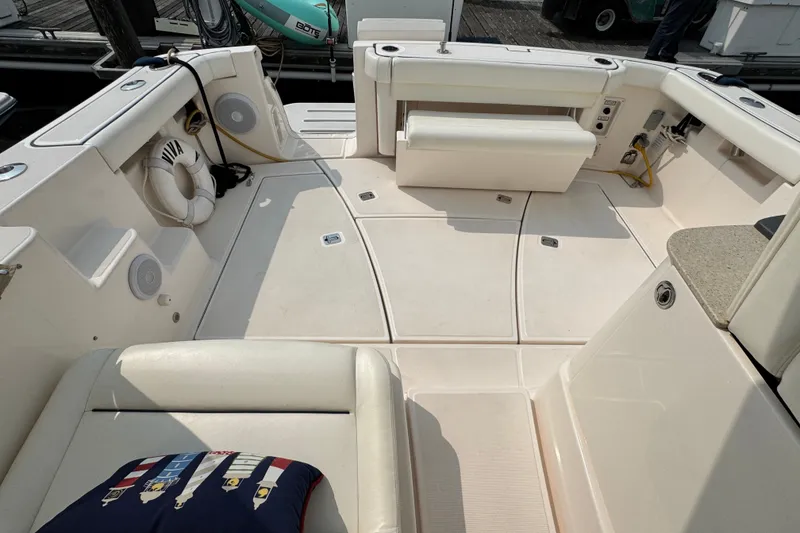 Slide: The Image of Spacious deck of 2008 Tiara 3000 Open boat with seating and life preserver. - 11