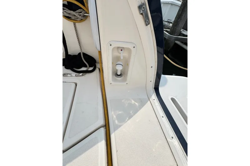 Slide: The Image of Tiara 3000 Open 2008 boat deck with rope and control panel. - 12