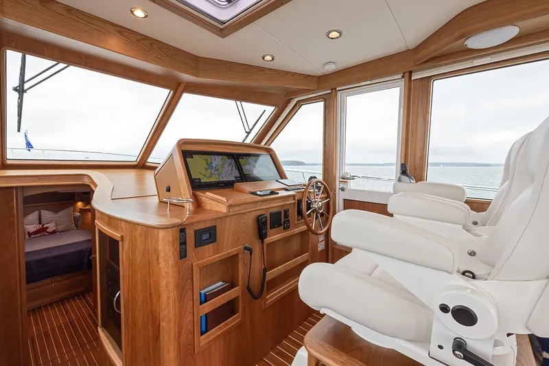 Slide: The Image of Luxurious interior of 2027 Sabre 45 Salon Express yacht with modern helm and seating. - 4