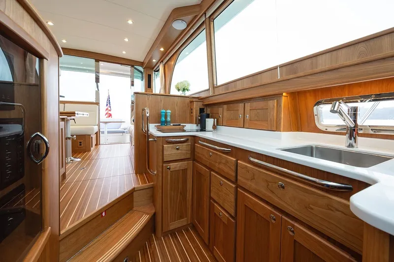 Slide: The Image of Luxurious interior of 2027 Sabre 45 Salon Express yacht with elegant wood finishes. - 9
