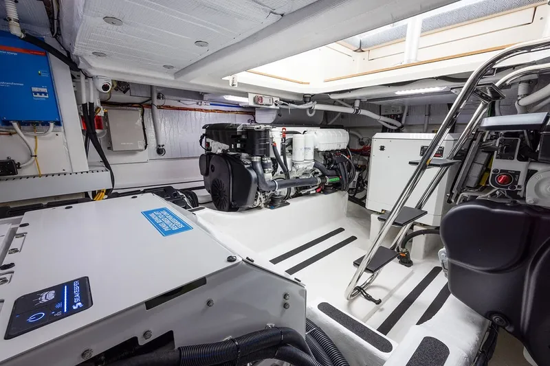 Slide: The Image of Engine room of 2027 Sabre 45 Salon Express yacht, showcasing modern equipment and design. - 16