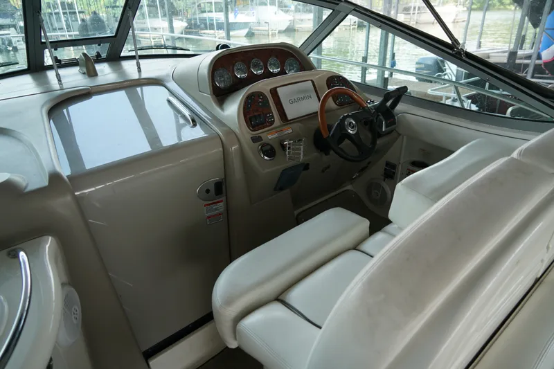 Slide: The Image of Interior helm of 2006 Sea Ray 300 Sundancer with Garmin navigation system. - 18