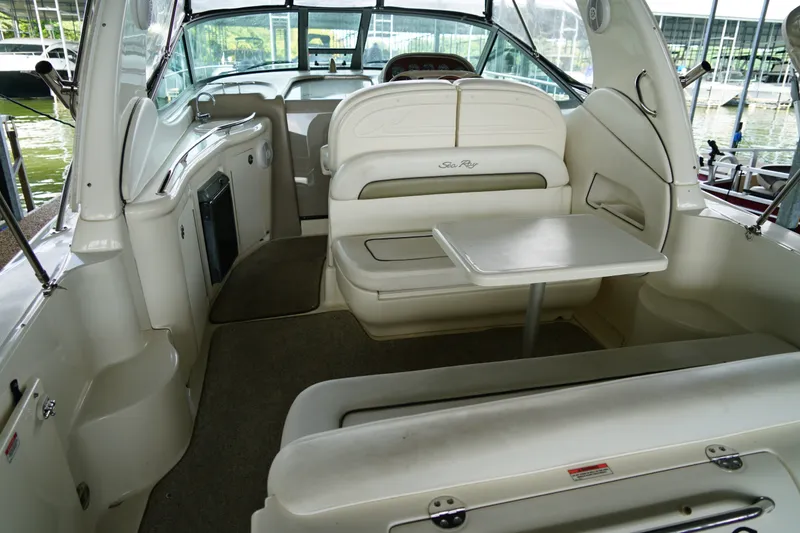 Slide: The Image of Interior of a 2006 Sea Ray 300 Sundancer boat with seating and table. - 15