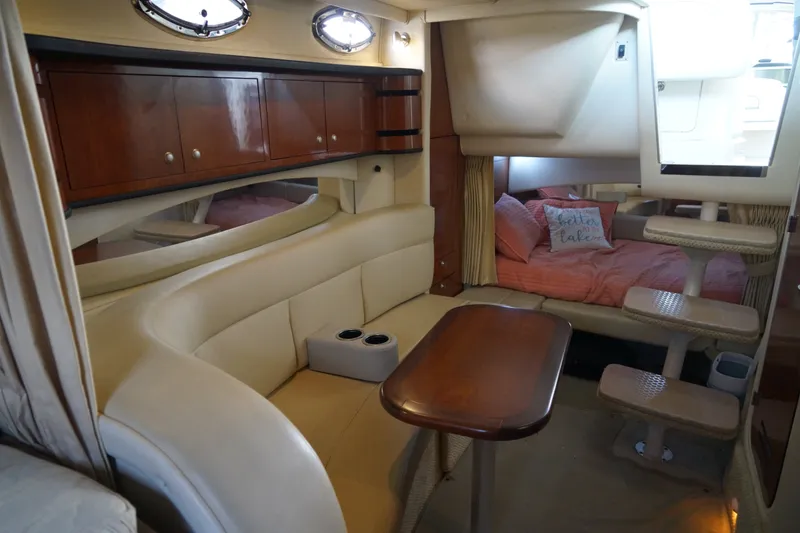 Slide: The Image of Interior of 2006 Sea Ray 300 Sundancer with cozy seating and sleeping area. - 29
