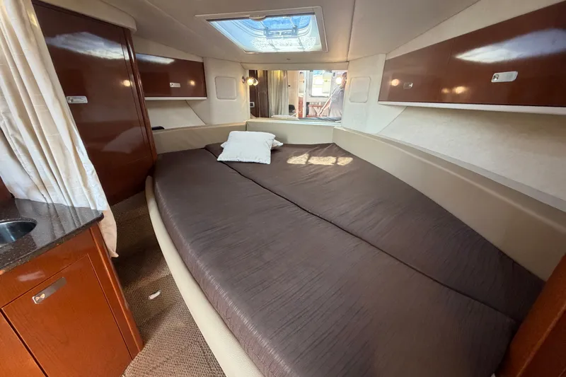 Slide: The Image of Luxurious cabin interior of 2012 Sea Ray Sundancer 330 yacht with cozy bedding. - 13