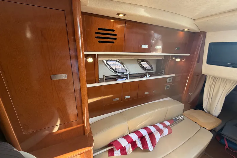 Slide: The Image of Interior of 2012 Sea Ray Sundancer 330 yacht with wood cabinetry and seating. - 15