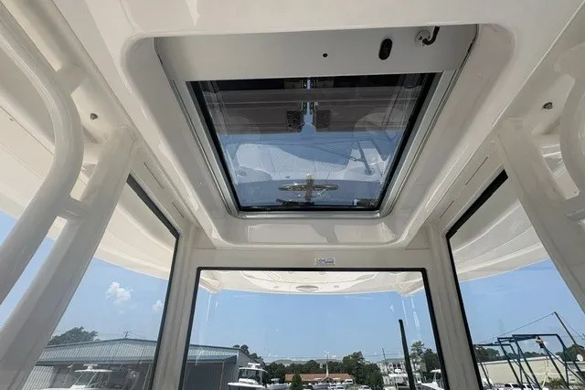 Slide: The Image of Interior view of 2027 Regulator 30XO boat with sunroof and clear windows. - 25
