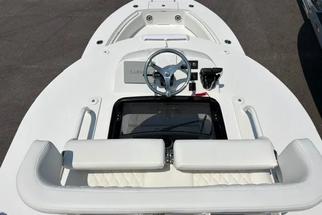 Slide: The Image of 2027 Regulator 30XO boat cockpit with steering wheel and seating. - 21