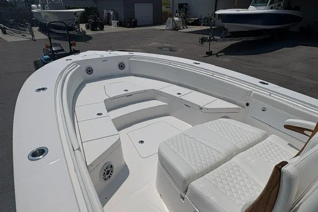 Slide: The Image of 2027 Regulator 30XO boat interior with white seating and spacious deck layout. - 29