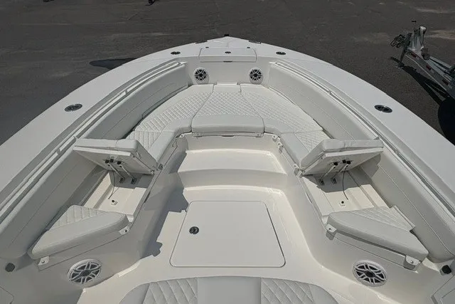 Slide: The Image of 2027 Regulator 30XO boat with spacious white seating and modern design. - 24