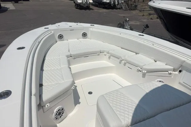 Slide: The Image of 2027 Regulator 30XO boat with spacious white seating and modern design. - 23