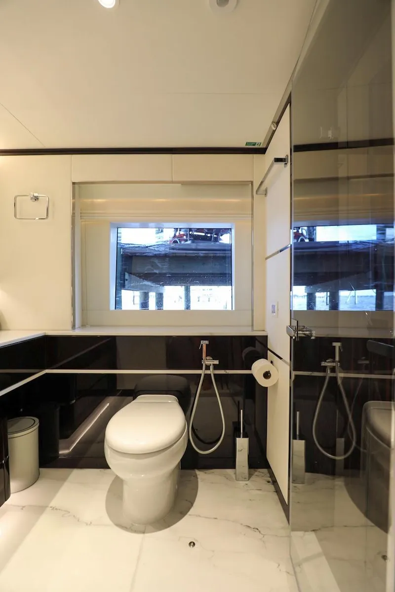 Slide: The Image of Luxurious bathroom in 2025 Majesty 120 yacht with modern fixtures and large window. - 51