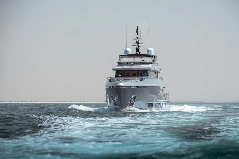 Slide: The Image of Majesty 120 yacht cruising on open water, 2025 model. - 13