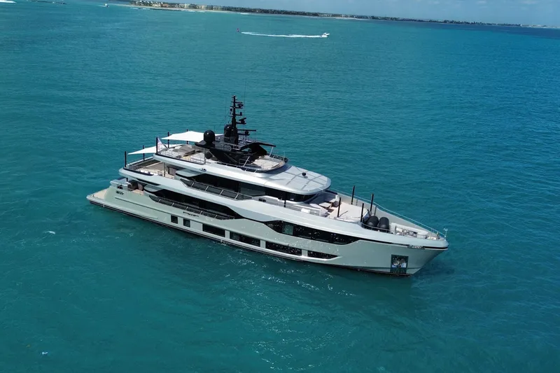 Slide: The Image of Luxurious 2025 Majesty 120 yacht cruising in clear blue ocean waters. - 0