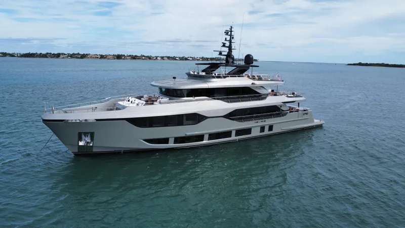 Slide: The Image of Majesty 120 yacht, 2025 model, cruising on calm blue waters under a clear sky. - 7