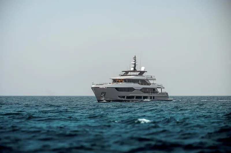 Slide: The Image of Luxury Majesty 120 yacht cruising on open sea, 2025 model. - 14