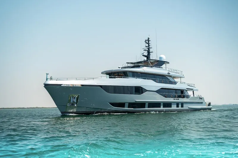 Slide: The Image of Luxury 2025 Majesty 120 yacht cruising on open water. - 8
