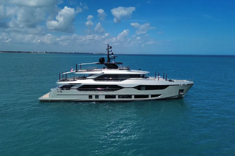 The Image of Luxurious 2025 Majesty 120 yacht cruising on clear blue ocean waters. - 1