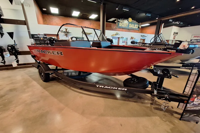 The Image of 2026 Tracker Pro Guide V-175 WT boat displayed in showroom on trailer. - 0