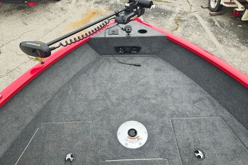 Slide: The Image of 2026 Tracker Pro Guide V-175 WT boat deck with trolling motor and carpeted surface. - 16