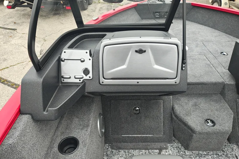 Slide: The Image of 2026 Tracker Pro Guide V-175 WT boat interior with gray carpet and storage compartments. - 14