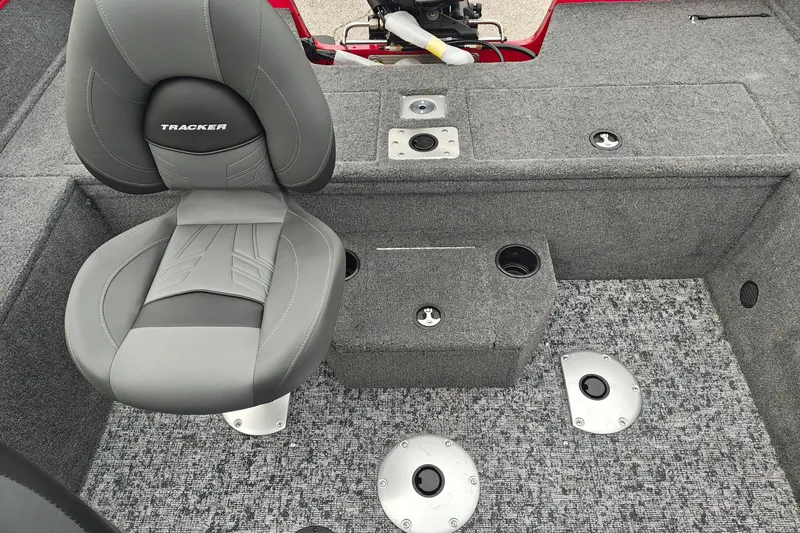 Slide: The Image of 2026 Tracker Pro Guide V-175 WT boat interior with gray seating and carpeted flooring. - 23