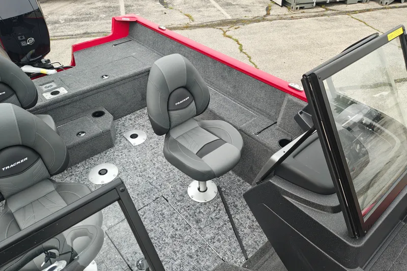 Slide: The Image of 2026 Tracker Pro Guide V-175 WT boat interior with gray seating and windshield. - 21