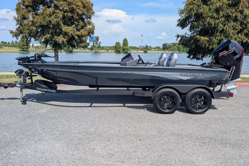 The Image of 2026 Ranger ALPHA 208 boat on trailer by a lake, showcasing sleek design and modern features. - 0