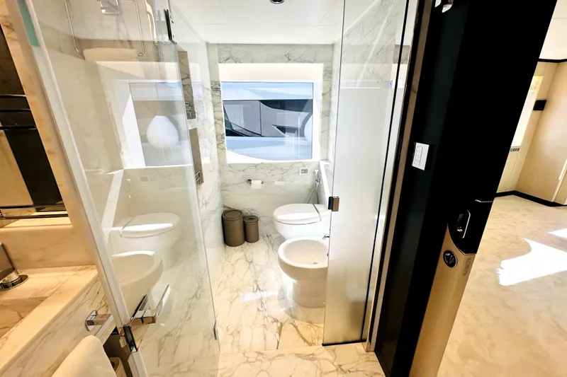 Slide: The Image of Luxurious marble bathroom interior on a 2023 Majesty 120 yacht. - 45