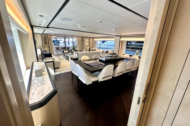 Slide: The Image of Luxurious interior of 2023 Majesty 120 yacht with elegant dining and seating areas. - 15