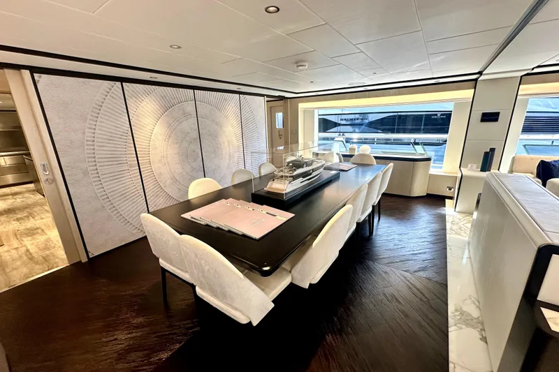 Slide: The Image of Luxurious interior of 2023 Majesty 120 yacht with elegant dining area and modern decor. - 13