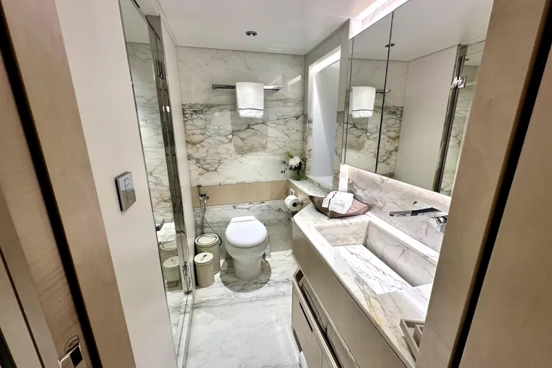 Slide: The Image of Luxurious marble bathroom in 2023 Majesty 120 yacht, featuring modern fixtures and elegant design. - 23