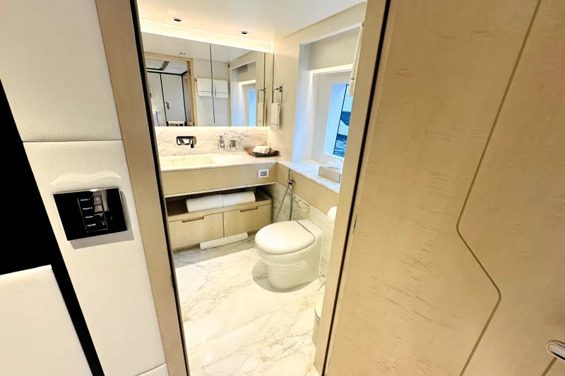 Slide: The Image of Luxurious bathroom interior on 2023 Majesty 120 yacht, featuring marble flooring and modern fixtures. - 33