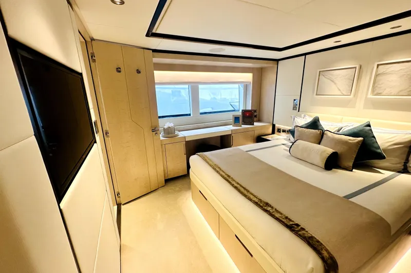 Slide: The Image of Luxurious bedroom interior of 2023 Majesty 120 yacht, featuring elegant decor and modern amenities. - 34