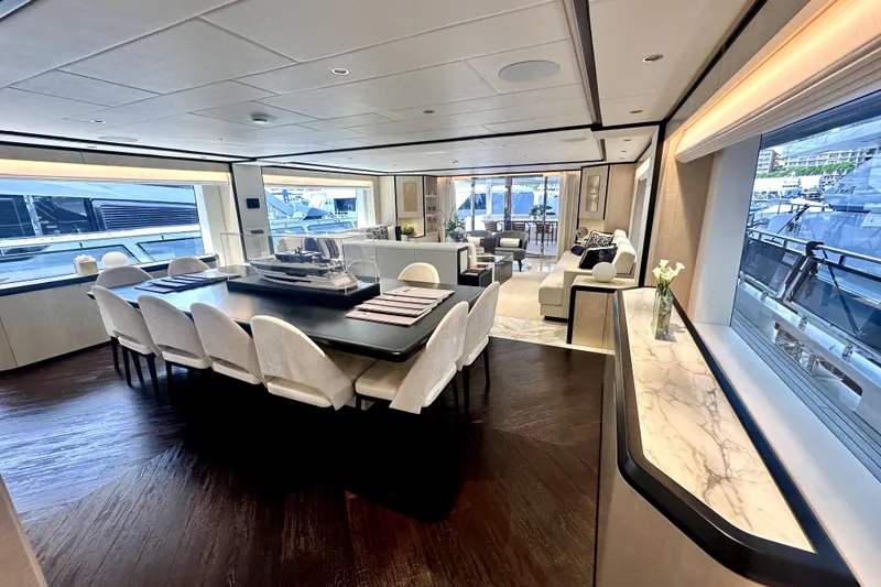 Slide: The Image of Luxurious interior of 2023 Majesty 120 yacht with elegant dining and seating areas. - 14