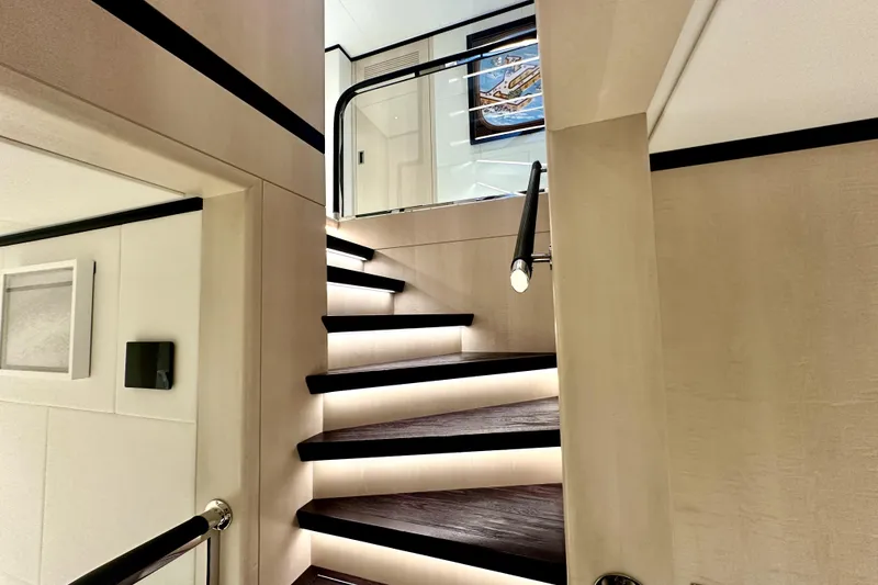 Slide: The Image of Luxurious interior staircase of 2023 Majesty 120 yacht with modern lighting. - 21