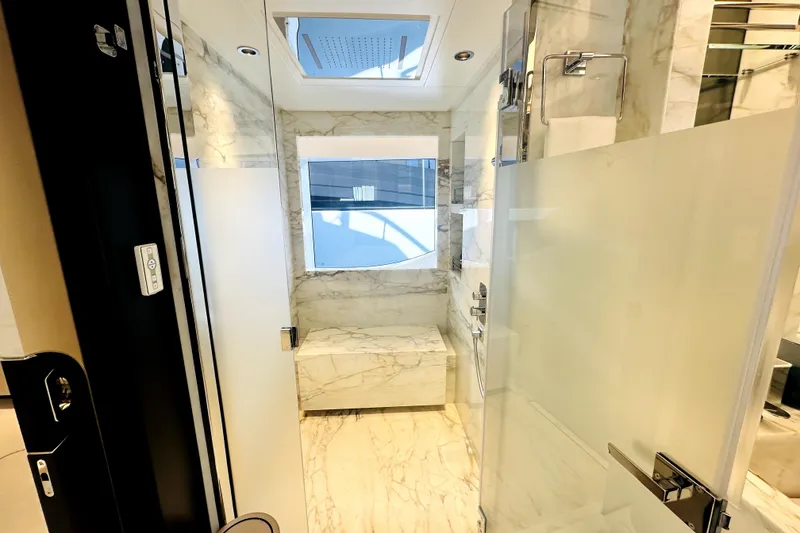 Slide: The Image of Luxurious marble bathroom in 2023 Majesty 120 yacht, featuring modern fixtures and natural light. - 46